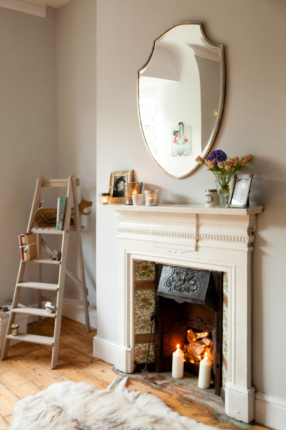 Fire surround with shield mirror