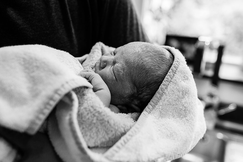 Newborn baby photography minutes after baby has been born