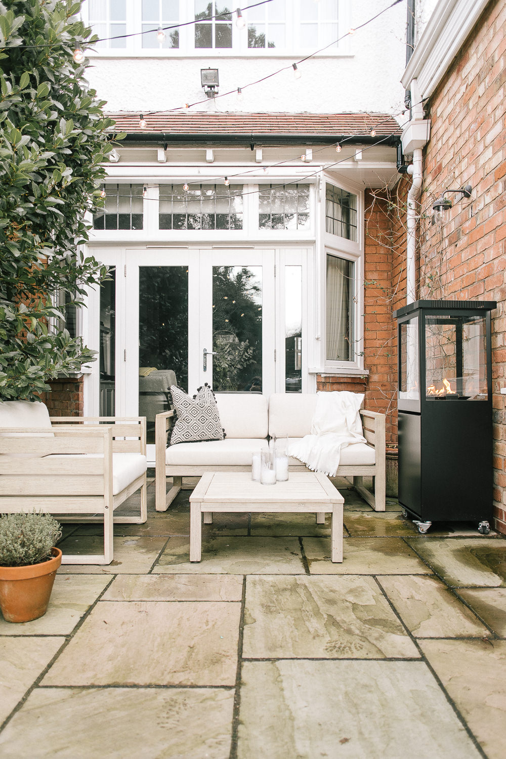 Garden of Claire's Characterful Edwardian Semi | Patio Seating with Festoon Lights and John Lewis St Ives Furniture