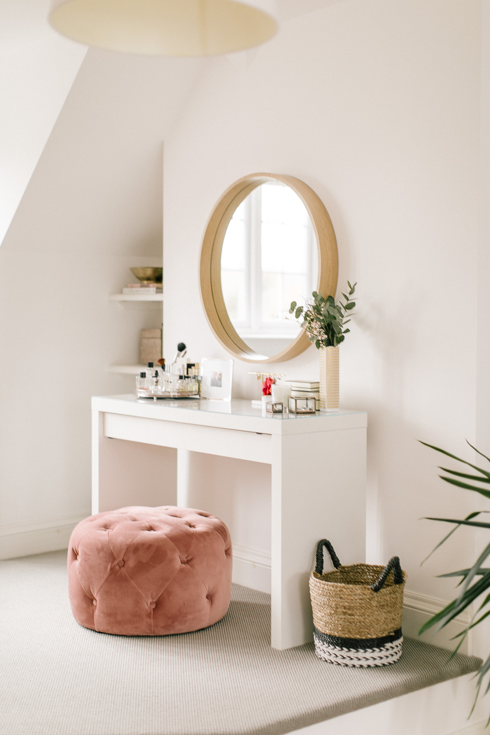 Light and bright dressing table area with blush pink pouffe and Ikea dressing table