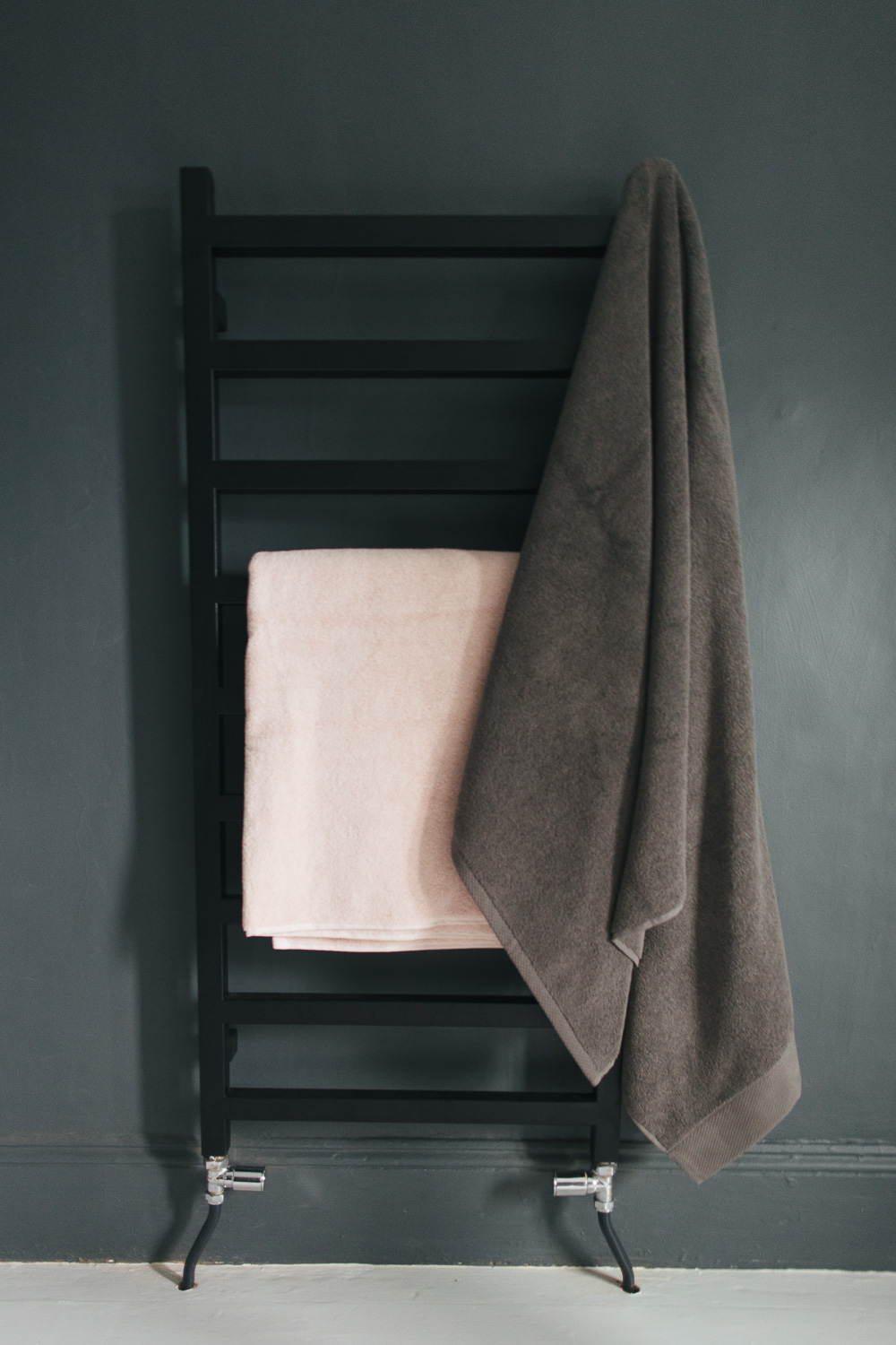 Black towel rail with Christy towels