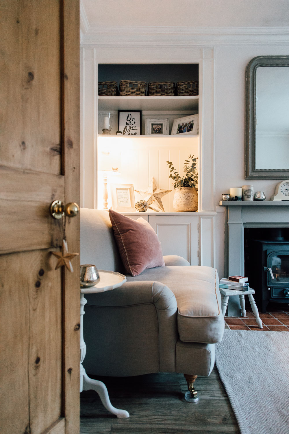 Log burner and snuggler seat in a cosy living room