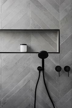 Multi shade grey herringbone bathroom tiles