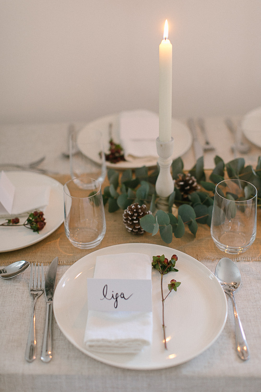 Christmas tablescape with red berries and eucalyptus