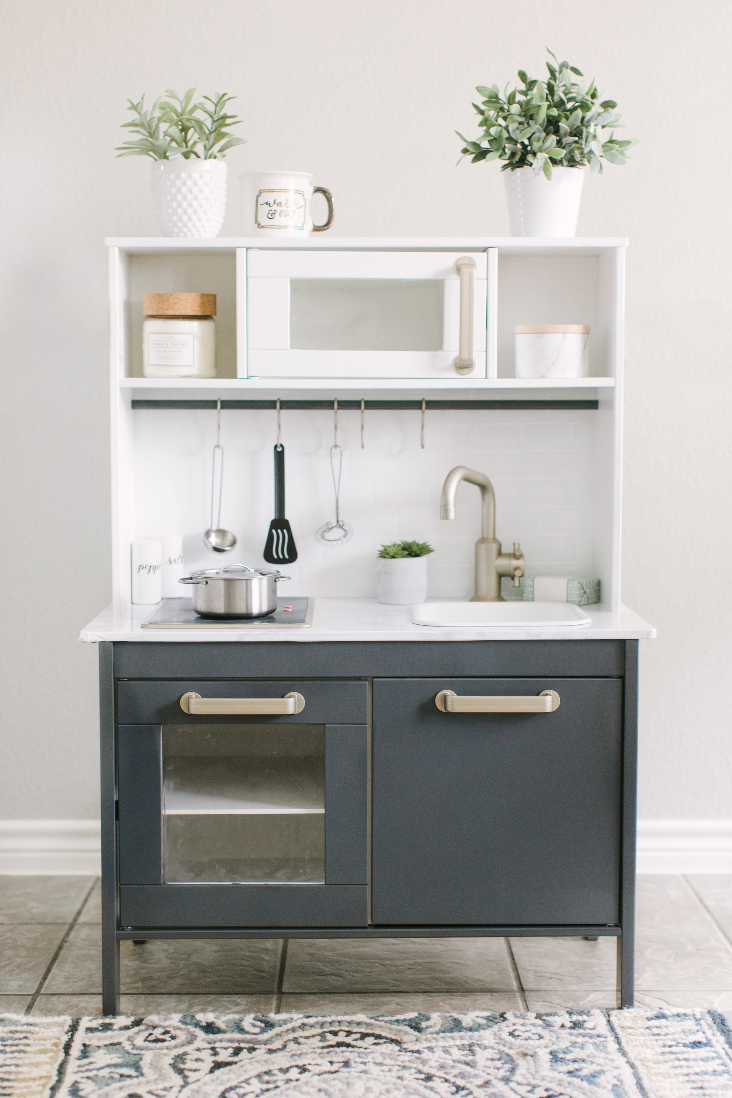 Navy and white ikea play kitchen with marble worktops