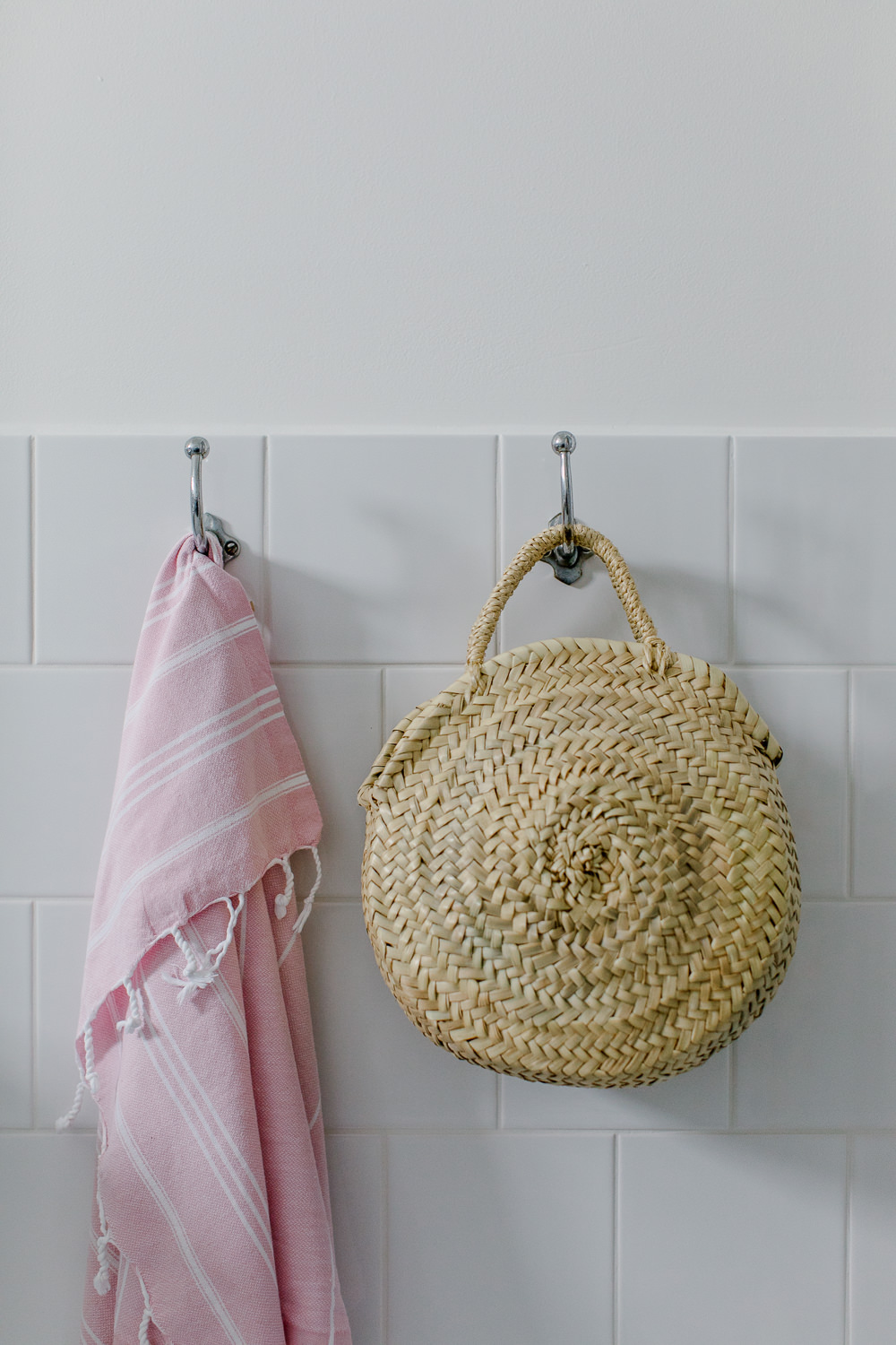 Vintage hooks with straw bag and pink hammam towel