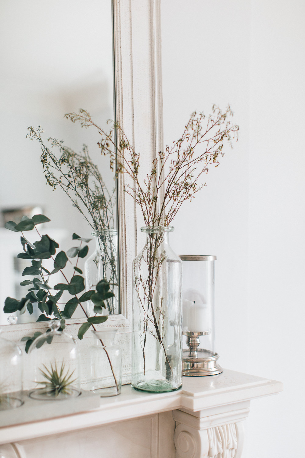 Glass vase with dried foliage