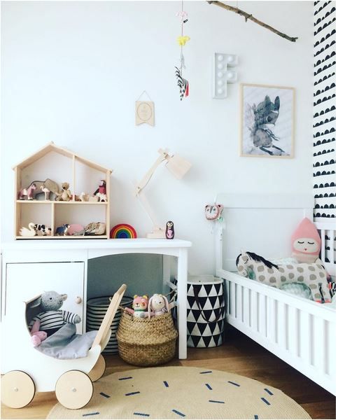 Pops of wood and colour in monochrome nursery