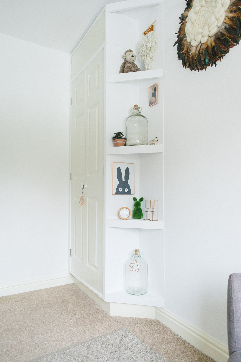 Shelf styling with wooden and natural accessories
