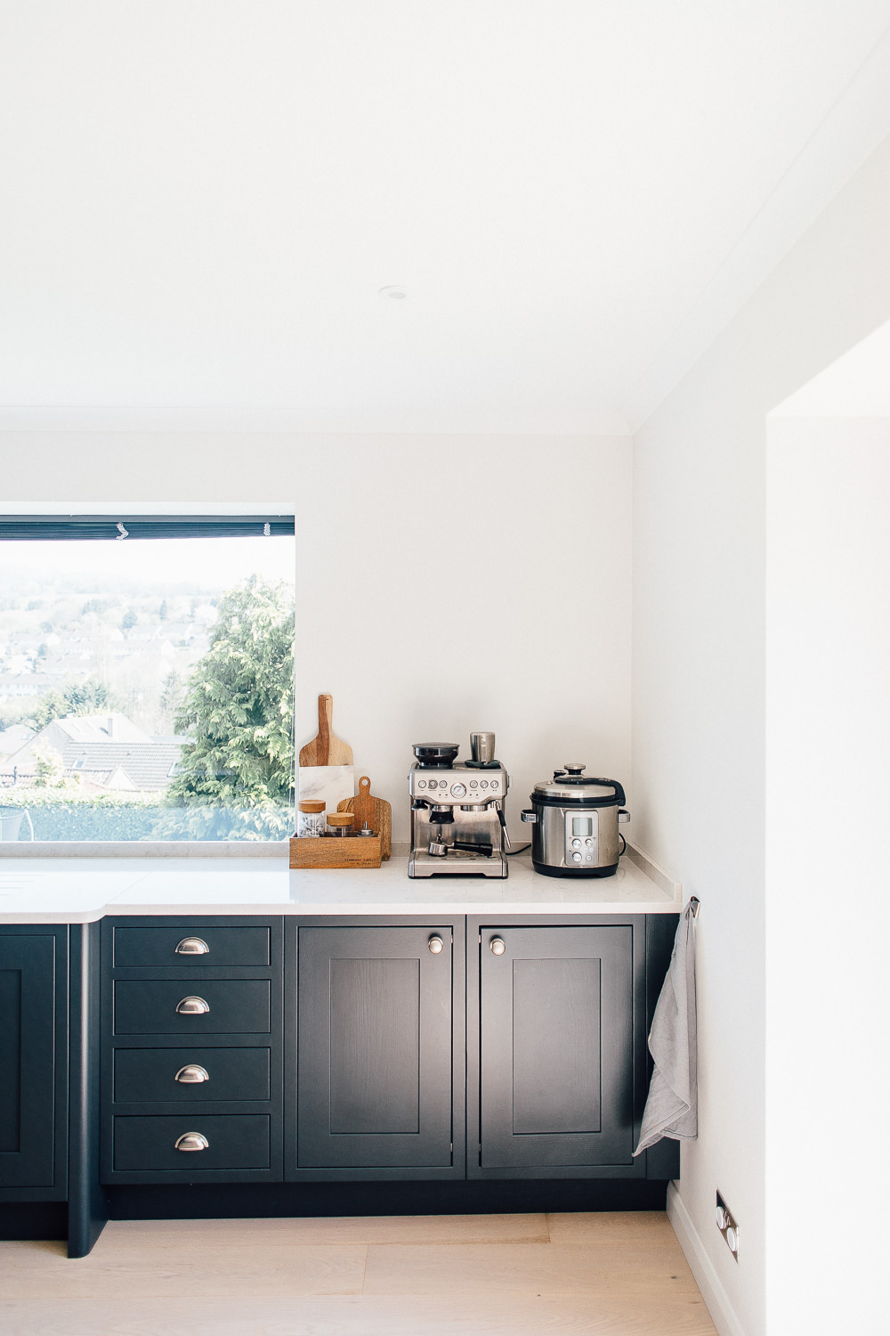 Silestone lagoon worktops and dark grey kitchen cupboards