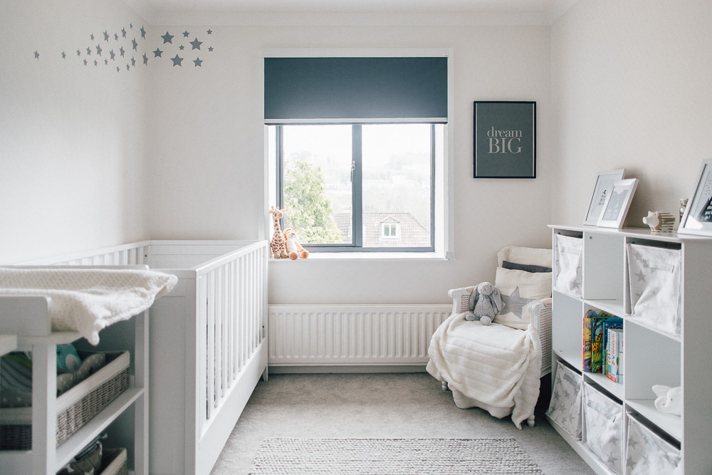 Bright and white nursery with grey accents and star war decal