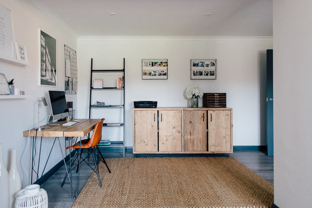 Industrial desk with hairpin legs and jute rug