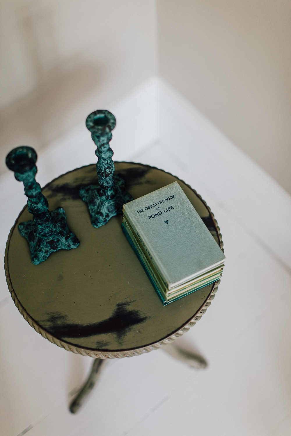 Candle sticks and vintage book