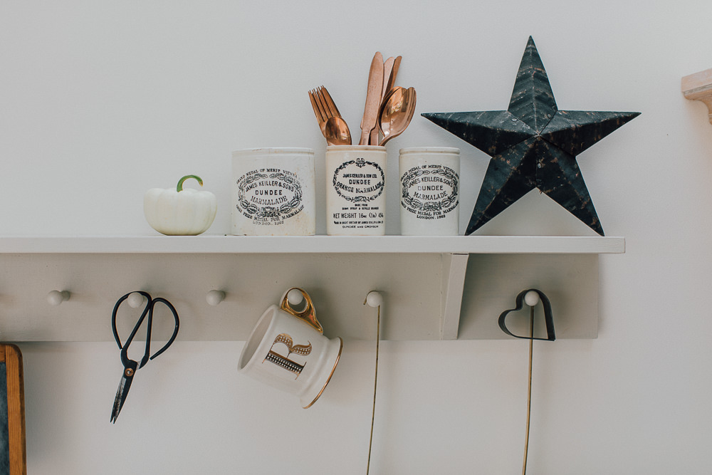 Peg board shelf with star and dundee marmalade jars with white pumpkin
