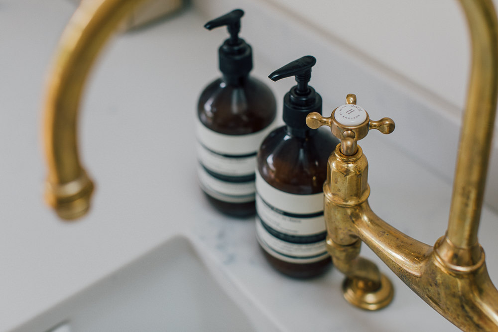 Butler sink with brass tap and Aesop handwash