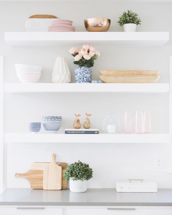 White shelves with blue and pink accessories