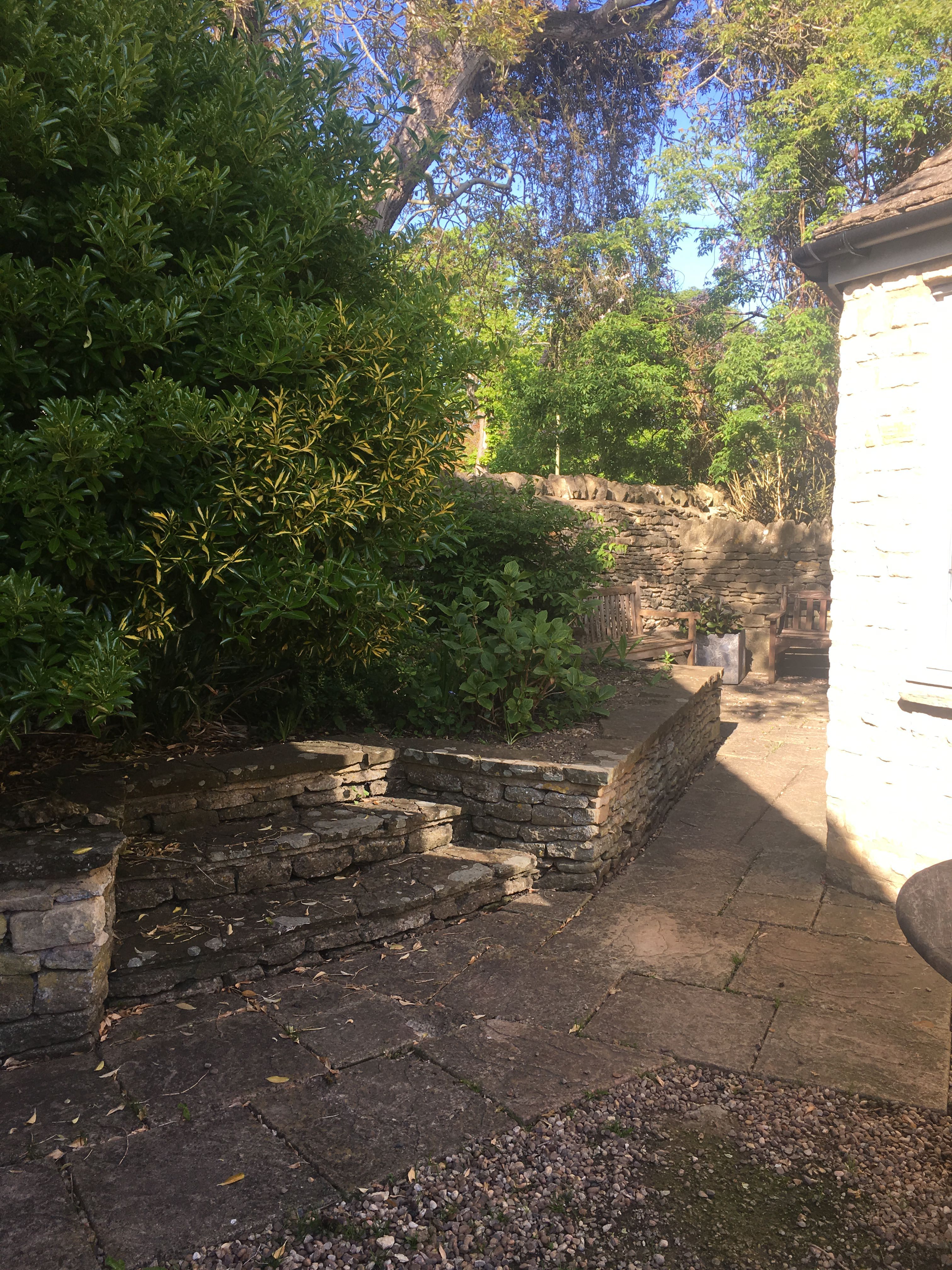 Before - Raised beds with stone wall and steps