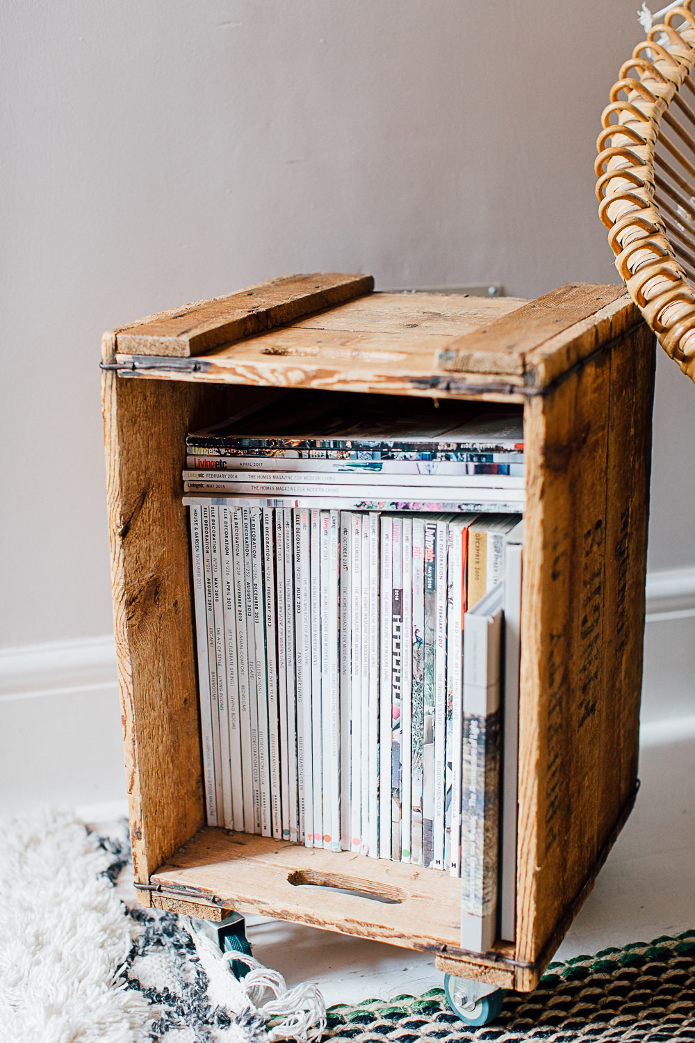 Wooden vintage crate filled with magazines