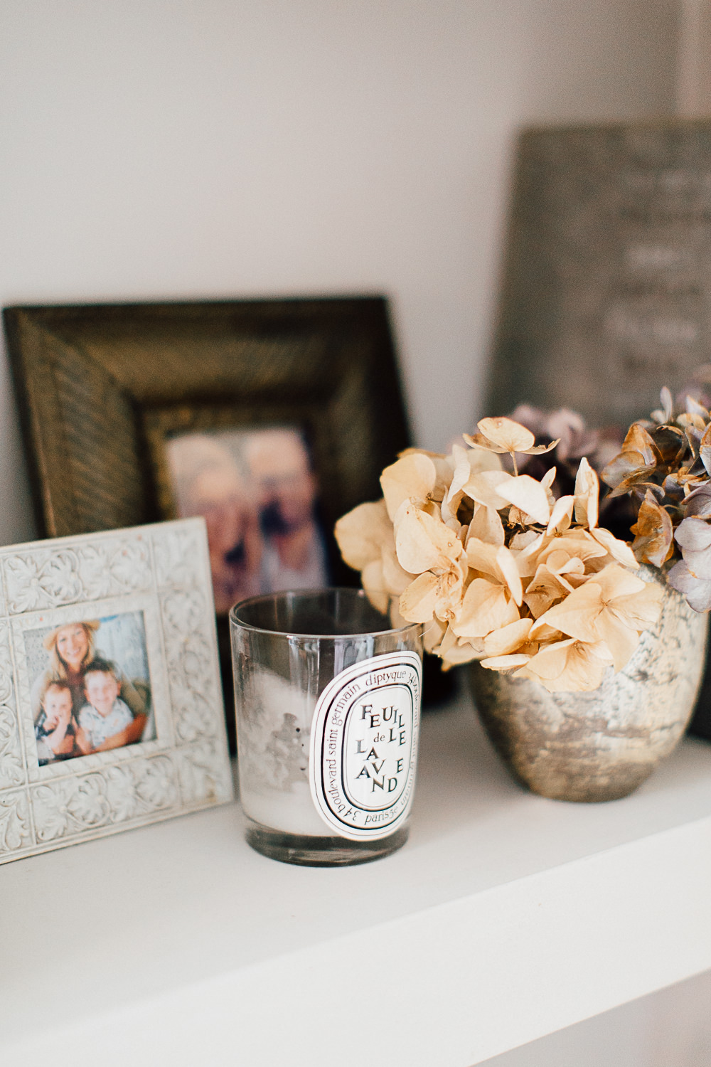 Framed photos and dried flowers