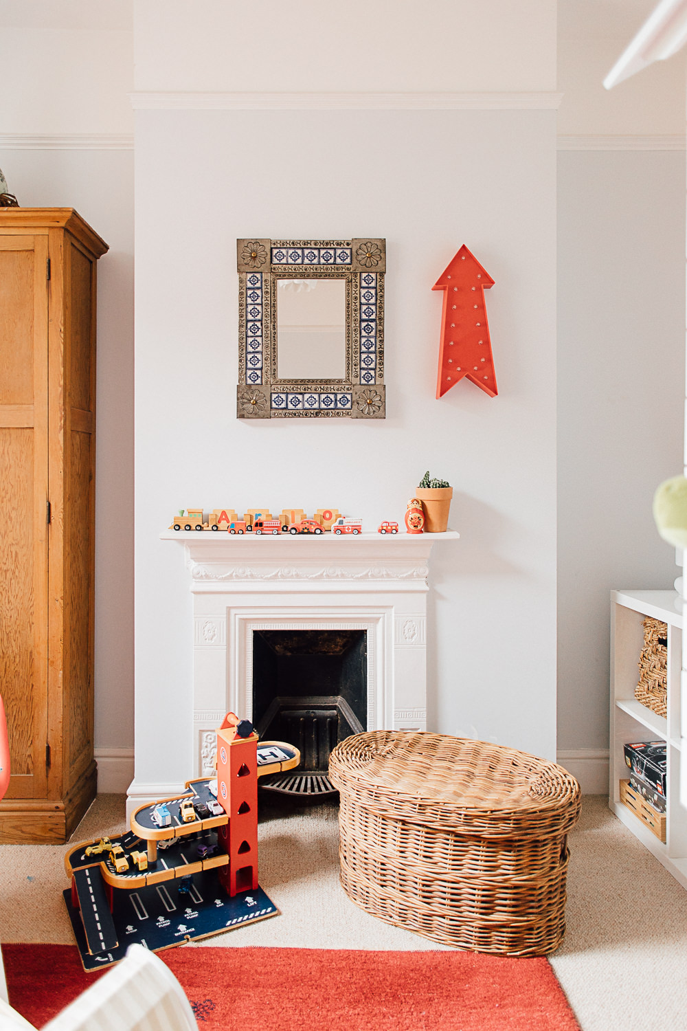 Edwardian fireplace in colourful kids bedroom