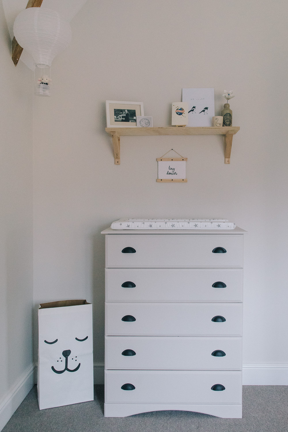 Plywood shelf over painted changing table