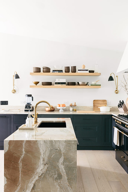 Kitchen of Rifle Paper Founder Anna Bond with dark units and waterfall worktops