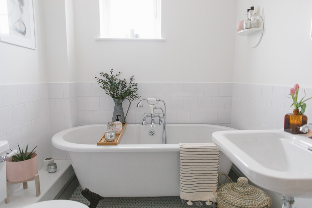 Square white bathroom tiles with white grout