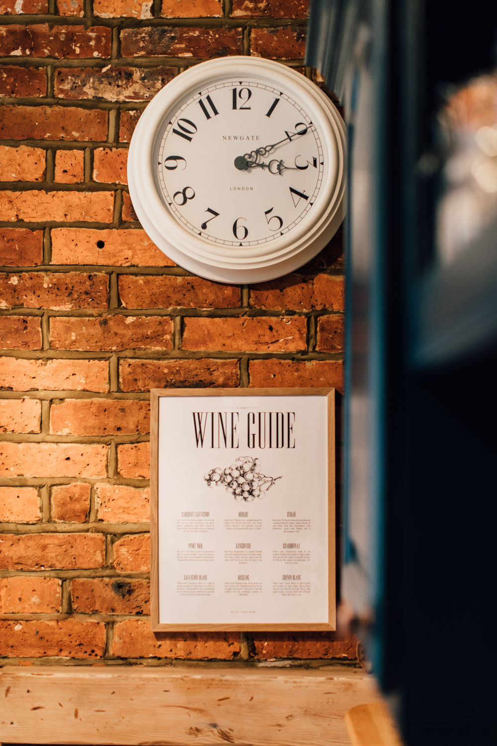 Kitchen clock on exposed brick wall